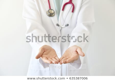 Stock photo: Doctor Showing Medicine To Patient At Hospital