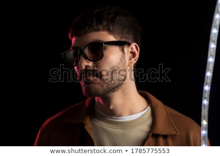 Zdjęcia stock: Man In Sunglasses Over Ultra Violet Neon Lights
