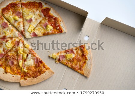 Stock fotó: Close Up Of Sliced Takeaway Pizza In Paper Box
