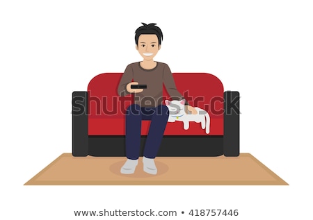 Stok fotoğraf: Relaxed Man Sitting On Armchair Holding And Petting Pet Cat