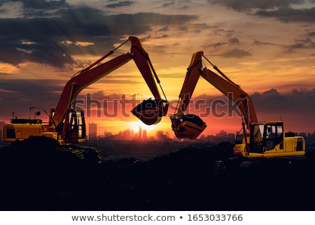 Foto stock: Two Orange Excavators