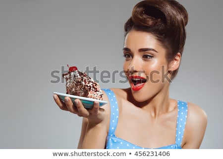Stok fotoğraf: Beautiful Young Woman Eating Chocolate Retro Potrait