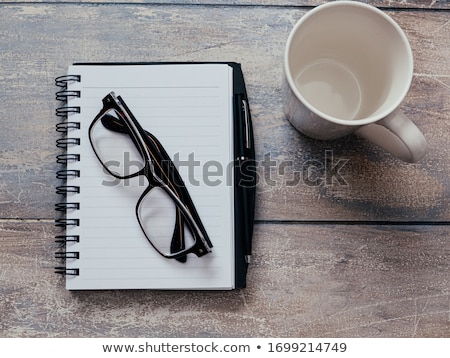 Stock photo: Empty Notepad With Reading Glasses