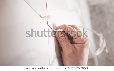 Stock foto: Worker Tiler Puts Ceramic Tiles