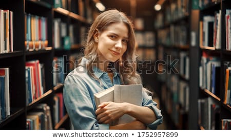 Foto stock: Young Students In A Library