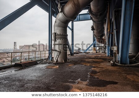 Stockfoto: Old Industrial Wall Of Pipes And Obsolete Parts
