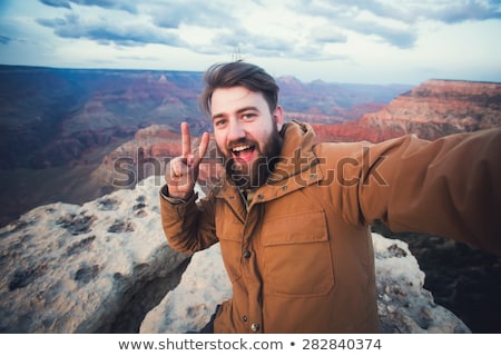 Foto stock: Happy Travelers Taking Selfie At Grand Canyon