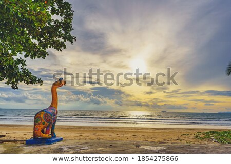 Stockfoto: Dinosaurs At Sunset At The Beach