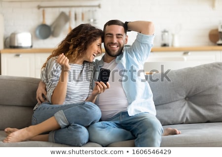 Сток-фото: Couple Embracing On Couch