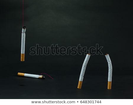 [[stock_photo]]: Cigarettes Tied With Rope And Wick