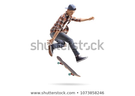 Stock fotó: Skater Performing A Stunt