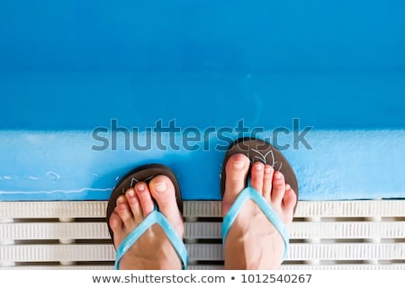 Stock fotó: Flip Flops At Swimming Pool