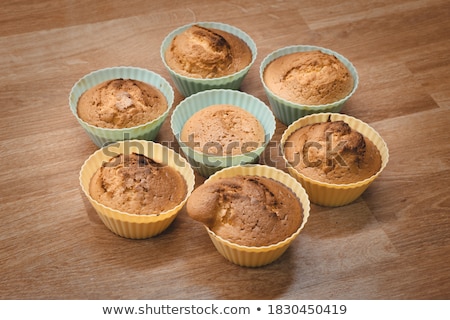 [[stock_photo]]: Yellow Silicone Cake Form On Wood Table