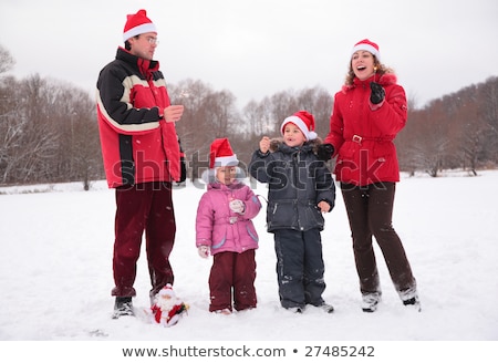 Stock photo: Mother With Children Burn Bengal Fires In Park In Winter