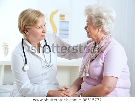 Stock photo: Medical Team Discussing Health Care Talking To Female Patient