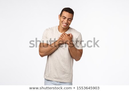 Foto stock: Romantic Muscline Boyfriend In White T Shirt Feeling Touched And Delighted Grateful For Heartwarmi
