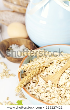 [[stock_photo]]: Bread Eggs Oats And Blue Vase