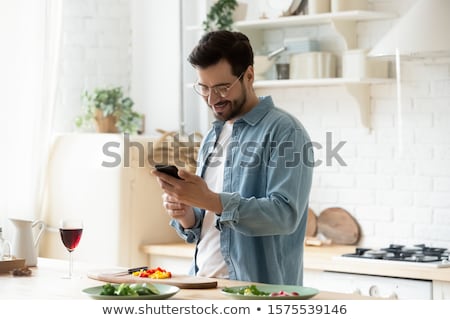 [[stock_photo]]: Young Man Preparing Lunch