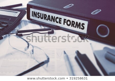 Foto stock: Ring Binder With Inscription Insurance Forms