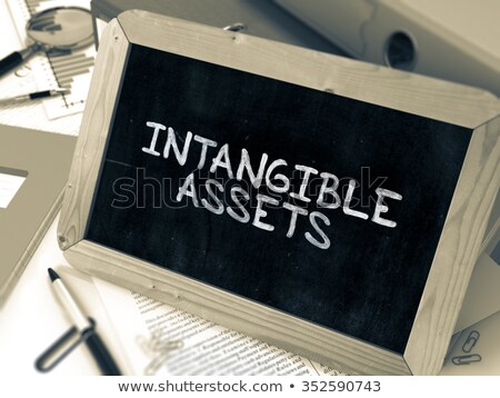 Сток-фото: Handwritten Intangible Assets On A Chalkboard