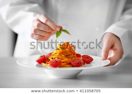 Foto d'archivio: Preparing Pasta Dish