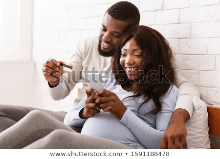 Stock photo: Mother And Baby With Phone And Credit Card