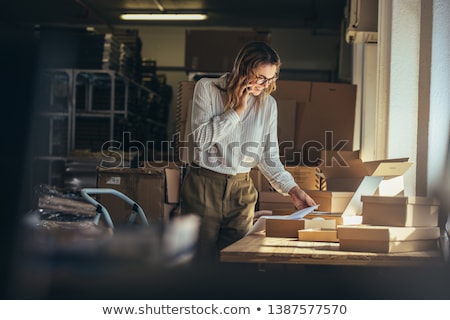 Stok fotoğraf: Woman Is Working At Warehouse For Online Store