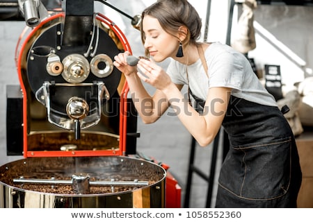 Stock photo: Woman Operating Coffee Roaster