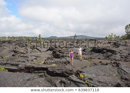 Hawaii Destination Travelers Couple Hiking In Volcanic Rocks On Kilauea Volcano In Big Island Of Haw Stockfoto © Maridav