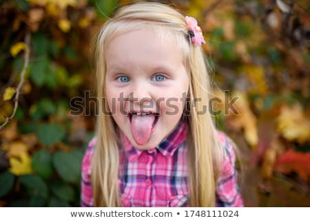 Stock photo: Girl With Tongue Out