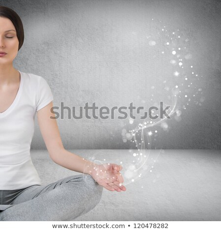 Foto stock: Pretty Young Woman Meditating In Empty Room And Graphic Smoke G
