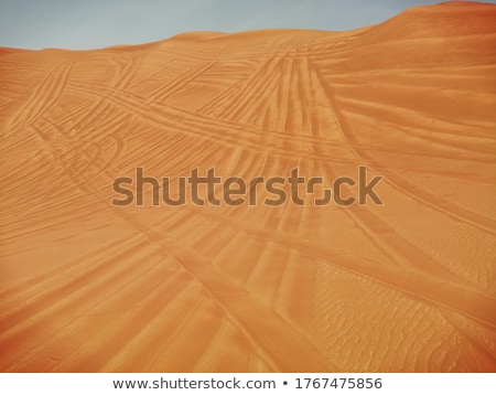 Zdjęcia stock: Sand Dune In The Desert With Marks Of Cars