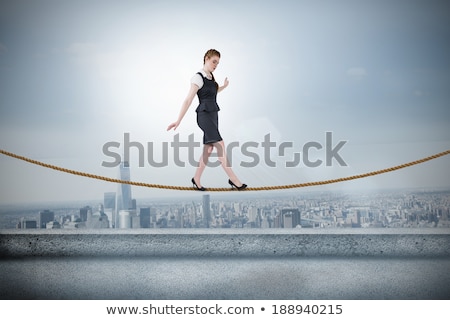 Stockfoto: Businesswoman Doing A Balancing Act