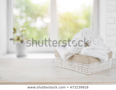 Beige And White Towel Over Table [[stock_photo]] © homydesign