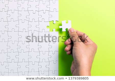 Stock photo: Problem Solved Concept - Placing Last Piece Of Jigsaw Puzzle