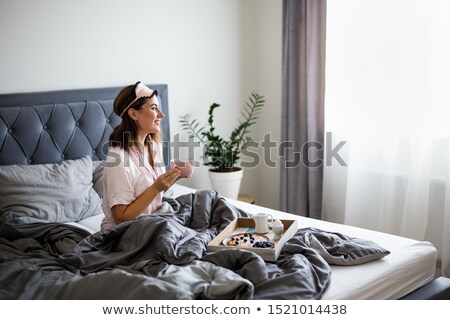 Stockfoto: Woman Sitting In Bedroom
