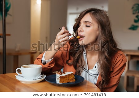 Stok fotoğraf: Woman Eating The Slice Of Cake