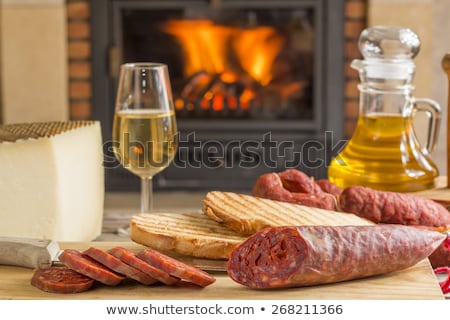 Сток-фото: Spanish Chorizo Sausage With Knife On Wooden Board