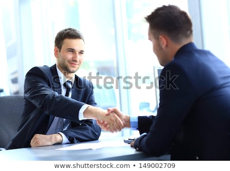 Stok fotoğraf: Happy Businessman Shaking Hands With His Partner