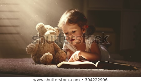 ストックフォト: Little Girl Reading A Book And Dreaming