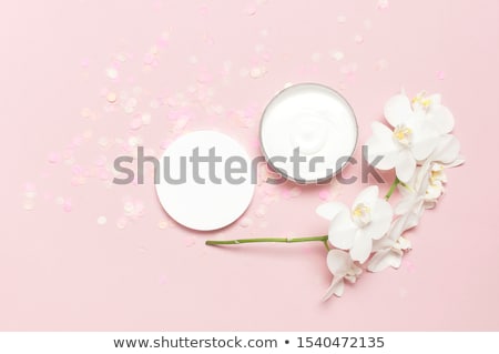 Stock photo: Luxury Face Cream Moisturizer For Facial Skin On Pink Flower Bac