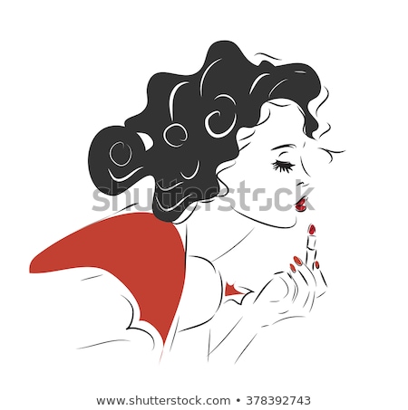 Foto stock: Young Woman Putting Lipstick