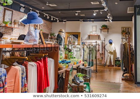 [[stock_photo]]: Woman Standing In Clothing Store