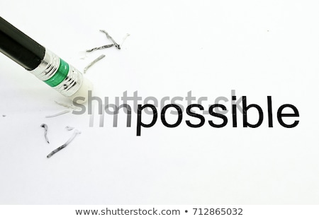 Foto stock: Changing The Word Impossible To Possible With A Pencil Eraser