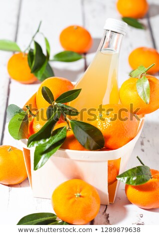 Stockfoto: Glass Bottle Of Fresh Mandarin Tangerine Juice