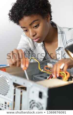 [[stock_photo]]: Blond Woman Repairing Computer