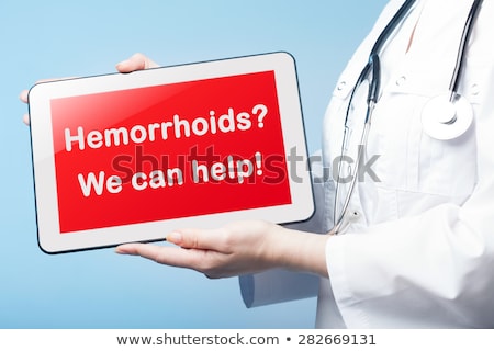 Foto d'archivio: Hemorrhoids On The Display Of Medical Tablet