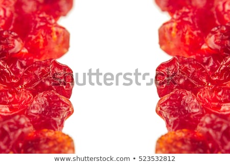 Foto stock: Dried Chirries Closeup On White Background Decorative Border Of Glossy Red Dried Cherry
