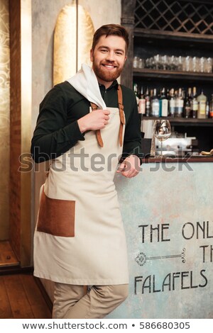 Foto d'archivio: Amazing Young Man Bartender Standing In Cafe