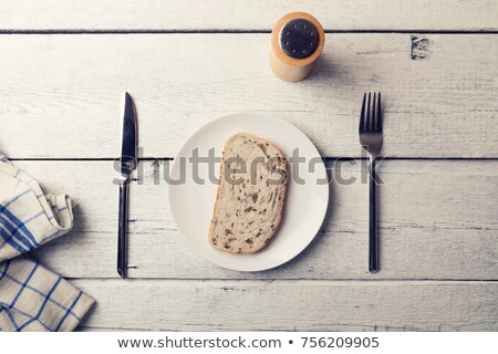 Stock photo: Poor Lunch - Slice Of Bread On A Plate And Cutlery On Wooden Tab